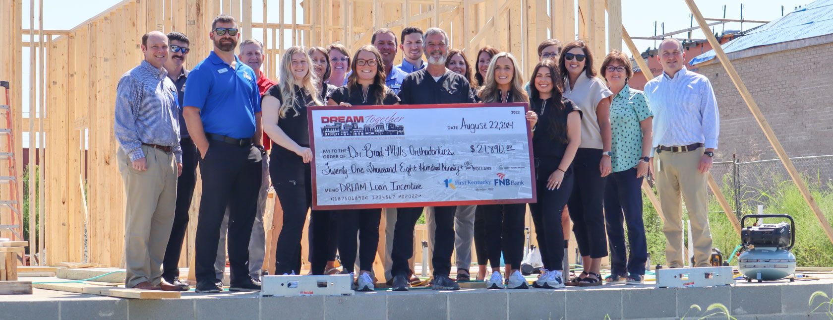 DREAM TOGETHER CHECK PRESENTATION HELD FOR DR. BRAD MILLS ORTHODONTICS