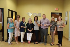 FNB Employees and Mayor Kathy O'Nan with Gift Cards for flood victims